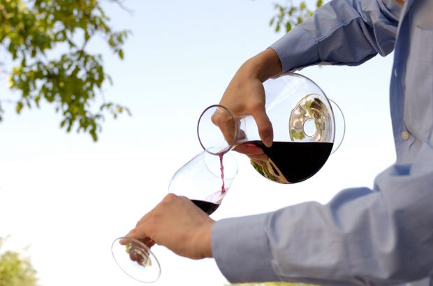Pouring wine from a decanter into a glass